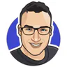 Illustrated avatar of Alex Schindler on a blue circular background