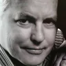Andrew Riedel in a close cropped black and white portrait